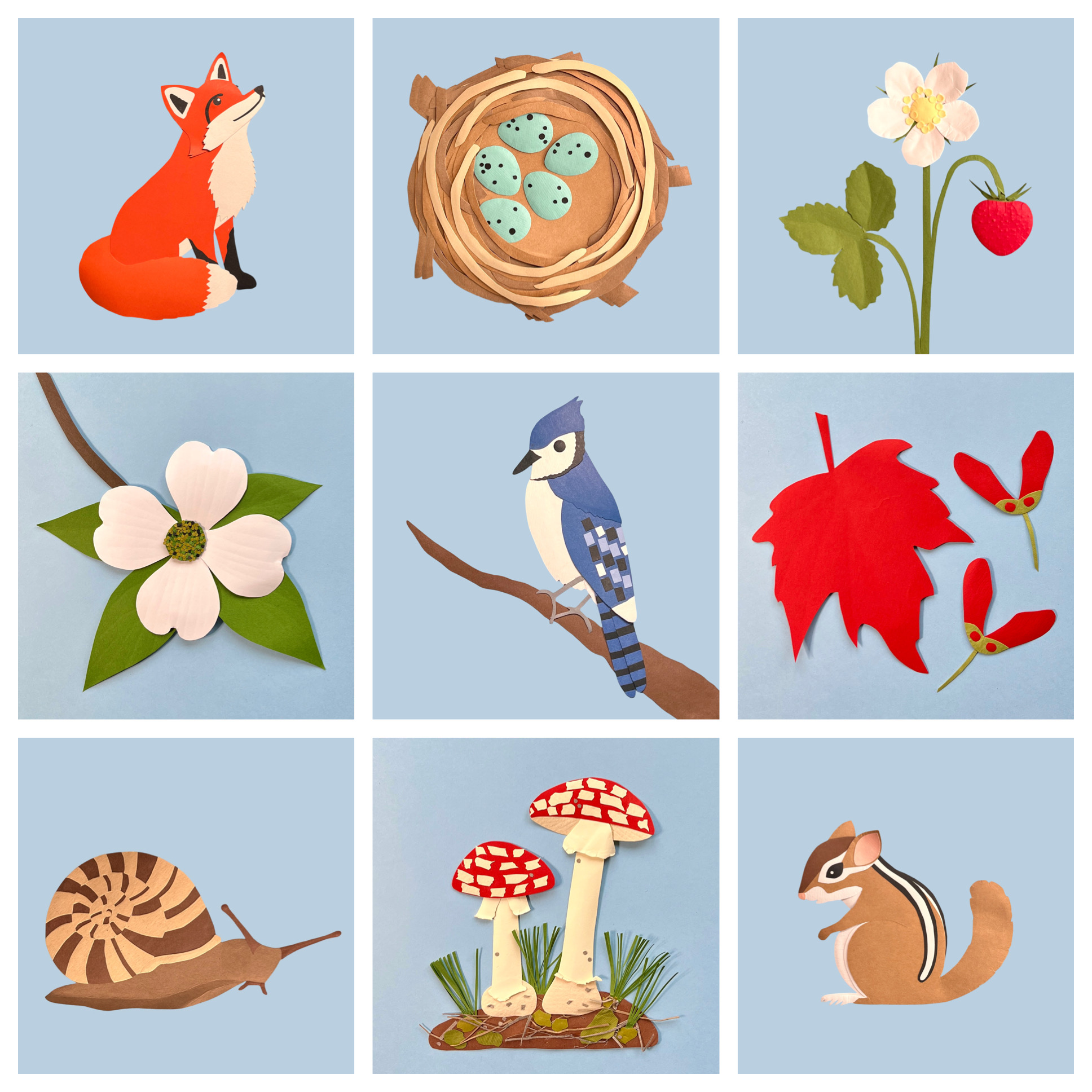 Nine hand-cut paper art tiles including fox, bird nest, strawberry, dogwood, blue jay, red maple, snail, mushrooms, and chipmunk